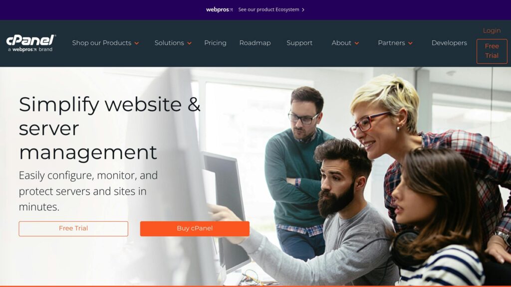 Group of four people looking at a computer screen. Text: "Simplify website & server management. Easily configure, monitor, and protect servers and sites in minutes."
